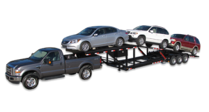 four car trailer being hauled by truck